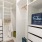 Closet space with shelves and ample lighting